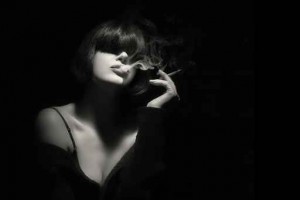 Smoke. Beauty Fashion Model Smoking a Cigarette